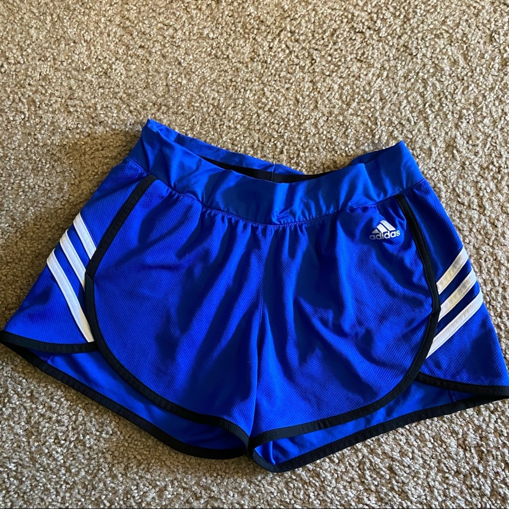 Blue adidas running shorts white stripes
